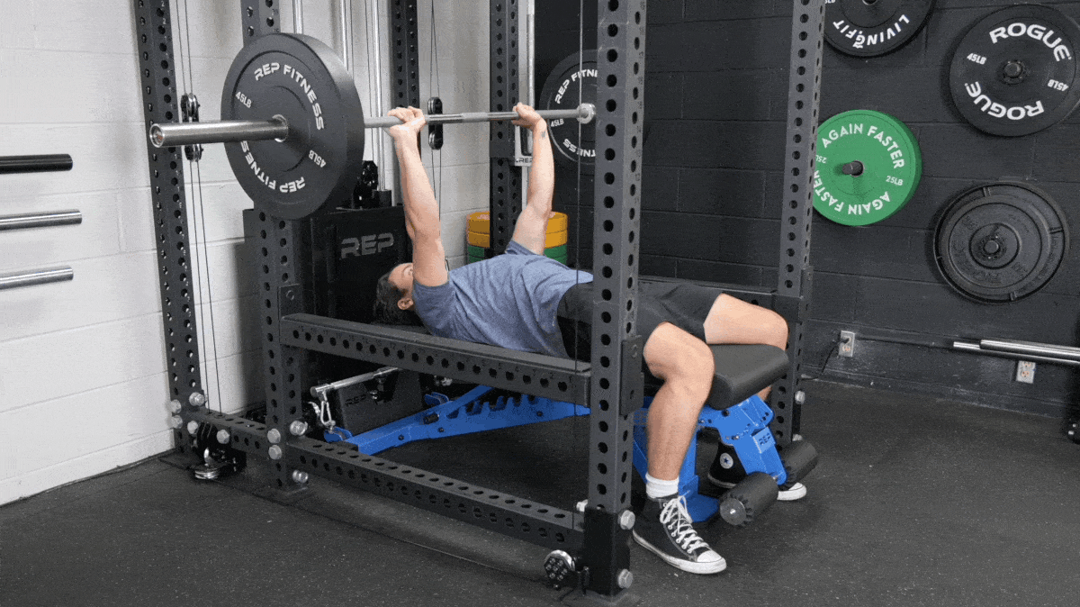 BarBend's Jake Herod performing the barbell bench press exercise in their bench press program.