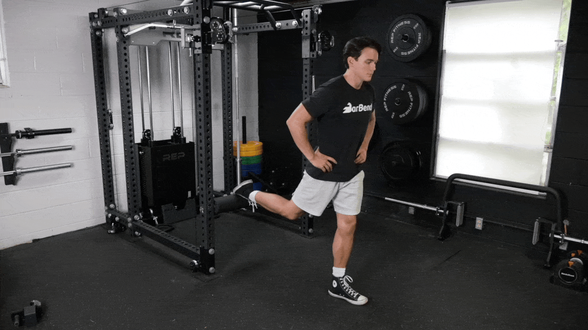 A person performing the bulgarian split squat exercise.